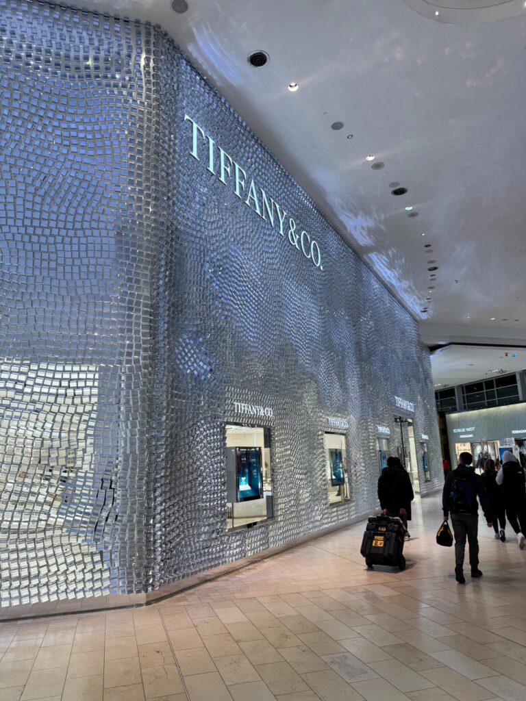 Mirrored tile storefront facade with display windows in a shopping centre