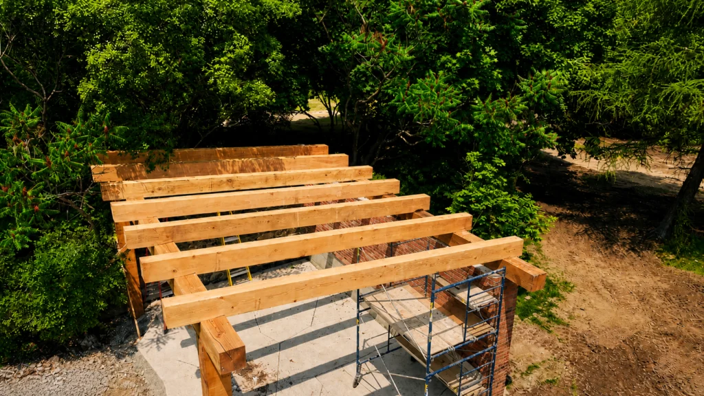Heavy timber pergola framing on a garden patio