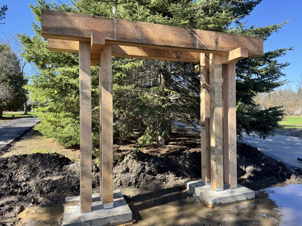Freestanding heavy timber arbour on concrete footings