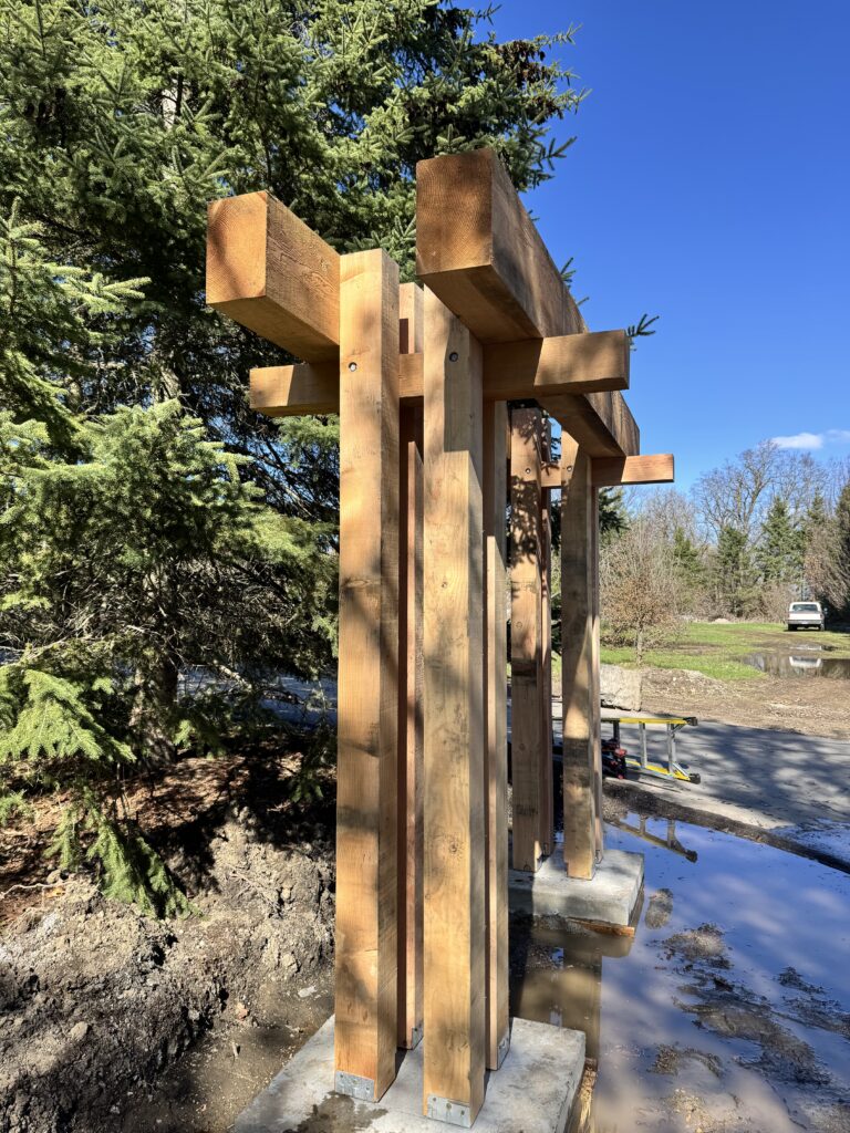 Heavy timber posts and beams for a driveway arbour